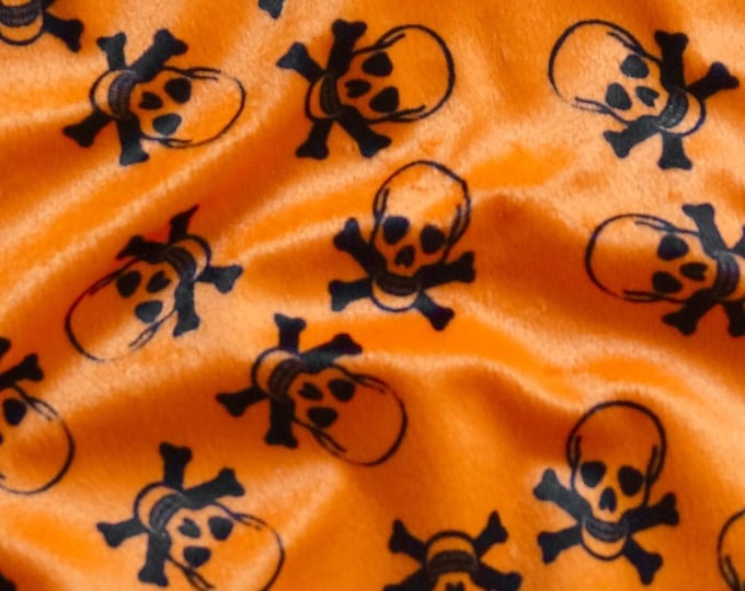 58"  Wide Black skull on orange Velboa Fabric per yard