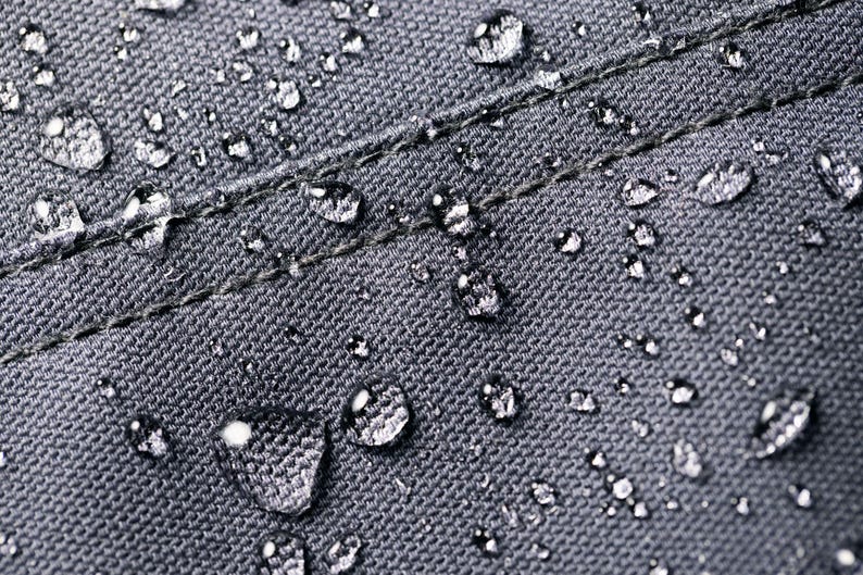 a close up of water drops on a cloth