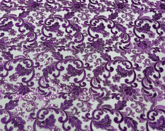 Lavender metallic corded embroider flowers with sequins on a mesh lace fabric
