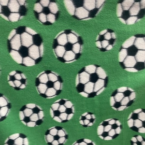 Soccer ball fleece fabric on green By The Yard 60&quot; Wide