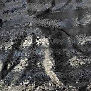 Black matte snake stretch vinyl fabric costumes, leggings, clothing  Sold by the Yard.