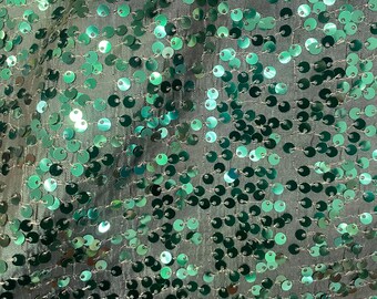 Hunter green seqiun on taffeta fabric 56” wide sold by the yard