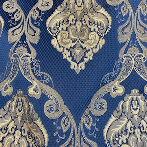May include: Blue fabric with a gold damask pattern. The fabric has a textured surface and a repeating pattern of stylized floral designs.