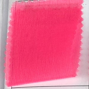 May include: A bright neon pink fabric swatch with the text #542 Neon Pink.