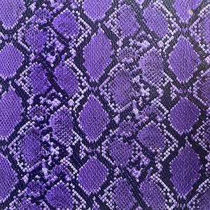 May include: Purple snakeskin pattern fabric with a textured surface.