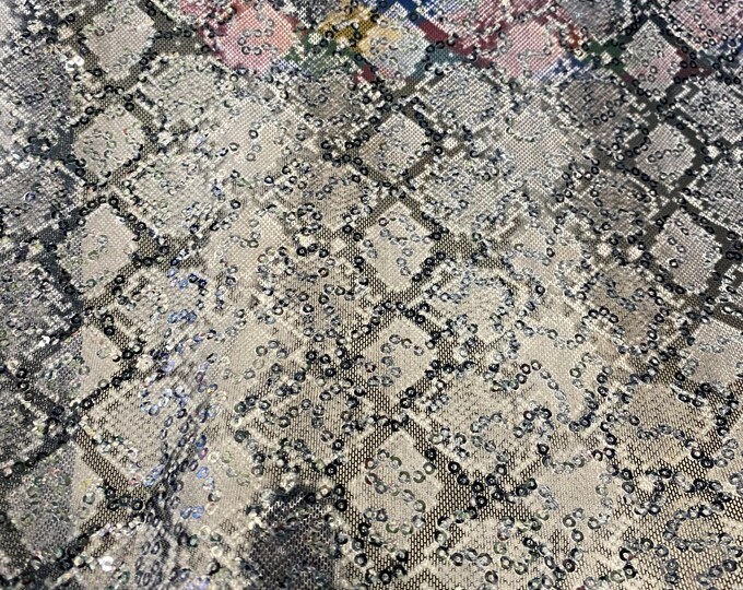 Snake black and white stretch lace with sequins all around 58” wide