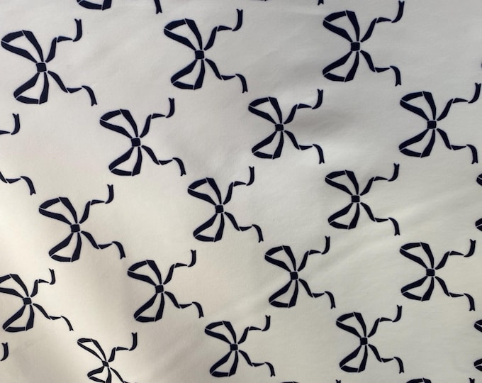 Black bows on white spandex 4  way  fabric by the yard