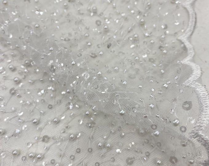 White pearls sequins on mesh fabric, 54 inches wide