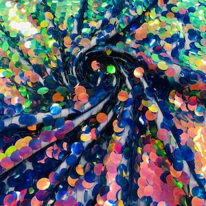 May include: A fabric featuring a dense arrangement of iridescent, circular sequins in shades of blue, green, orange, and pink. The sequins are attached to a sheer black mesh base, creating a swirling, reflective pattern across the surface.