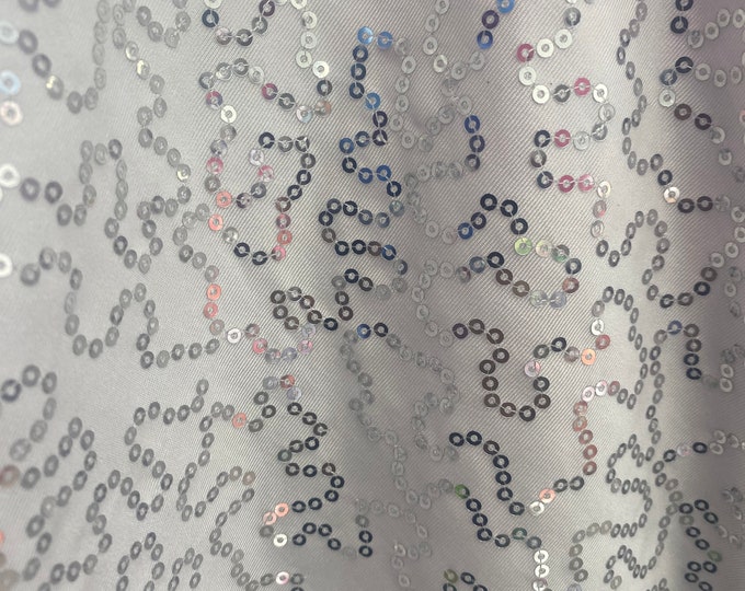 Silver sequins on white stretch spandex Fabric By The Yard