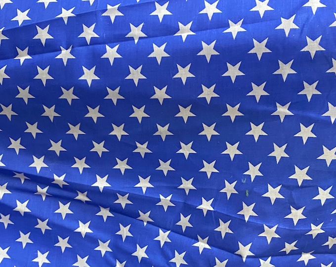 White stars on blue Poly cotton fabric sold by yard  58" wide