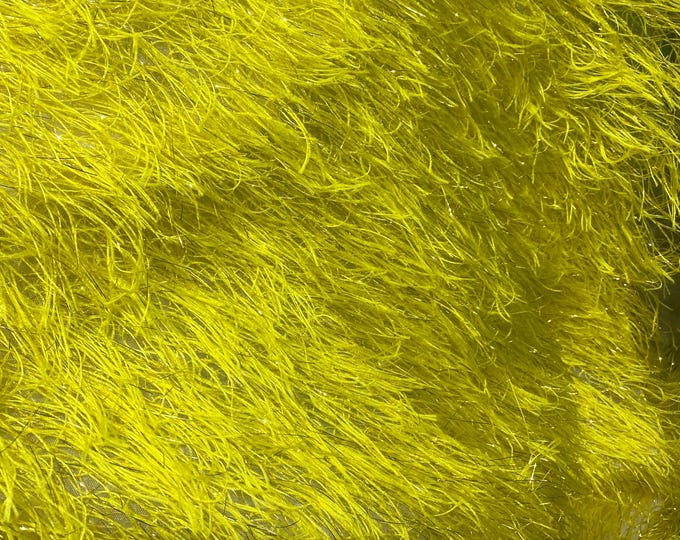 Yellow feather tinsel on mesh fabric per yard 60" wide