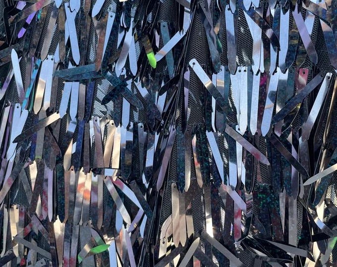 Sword shape black hologram sequins sewn on black mesh fabric sold by yard 56” wide