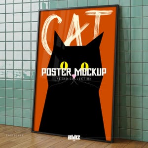 May include: A framed poster featuring a black cat design on an orange backdrop. The word "CAT" is written in white brushstrokes above the cat's head. The text "POSTER MOCKUP RETRO COLLECTION" is displayed below the cat. The poster is in a black frame.