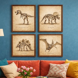 May include: Four framed vintage-style dinosaur skeleton prints. The prints feature a Tyrannosaurus Rex, Triceratops, Stegosaurus, and Pteranodon. Each print has a sepia-toned background and is labeled with the dinosaur's name.