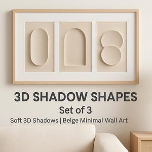 Puede incluir: Una obra de arte mural enmarcada con tres formas de sombra 3D beige: un óvalo, un arco y dos círculos. La obra de arte está sobre un fondo beige. El texto "3D SHADOW SHAPES Set of 3" se muestra debajo.