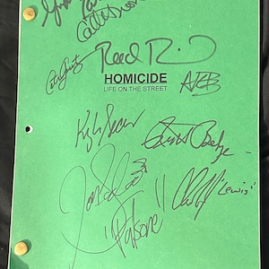 May include: A green script with multiple signatures in black ink. The title "Homicide: Life on the Street" is printed in the center. Brass fasteners secure the script. Signatures include "Reed R. D" and "ARB".