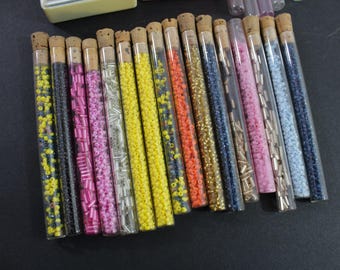 Multicolored Beads in Glass Tubes (16), 5 Empty Tubes, 2 Plastic Boxes, Bugle and Donut Shapes