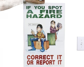 May include: A white poster with green and red text that reads "If you spot a fire hazard, correct it or report it". The poster features a cartoon illustration of two men, one holding a bucket of water and the other holding a cigarette. The poster also includes the text "No Smoking" in a small box.
