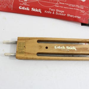 Vintage Crock Stick set from the 70s showing the wooden holder which stores 2 whetstone rods when not in use.