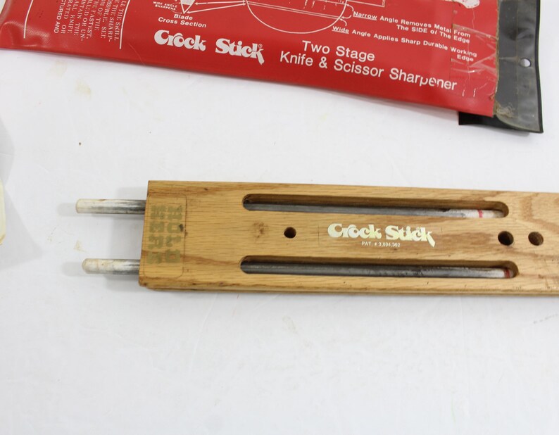 Vintage Crock Stick set from the 70s showing the wooden holder which stores 2 whetstone rods when not in use.