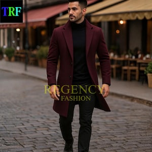 May include: A burgundy overcoat, black turtleneck, and black trousers. The coat is buttoned and has a classic design. The text "REGENCY FASHION" is visible on the coat. The image also shows the text "TRF" in the upper left corner.