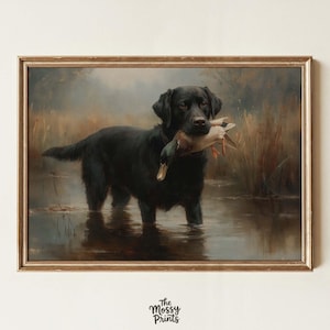 May include: A framed vintage-style print depicts a black Labrador Retriever standing in water, holding a duck in its mouth. The dog is the focal point, with a detailed rendering of its fur and expression. The background features a muted landscape.