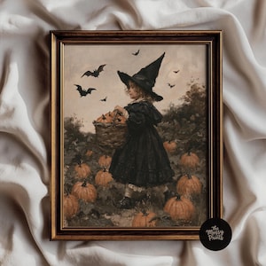 May include: A framed wall art print depicting a child wearing a black witch hat and a dark dress, carrying a woven basket filled with orange pumpkins in a field. Several bats fly in the muted sky above, and more pumpkins are scattered on the ground.