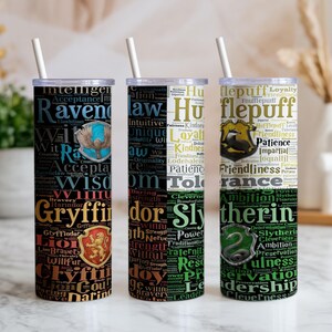 May include: Three cylindrical tumblers with white straws, each featuring a collage of words and house crests from the Harry Potter series. The designs display Ravenclaw, Gryffindor, Hufflepuff, and Slytherin themes with their respective colors.