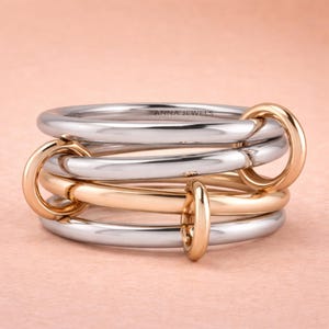 Two-Tone Multi-Band Ring - 4-Piece Linked Silver Ring Set with Rose Gold Plated Jumps