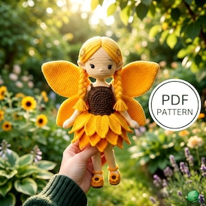 May include: A crochet doll featuring yellow hair in two braids, large yellow wings, and a brown and yellow sunflower-inspired dress. The doll has pointed ears and wears yellow shoes. A circular white graphic displays the text PDF PATTERN.