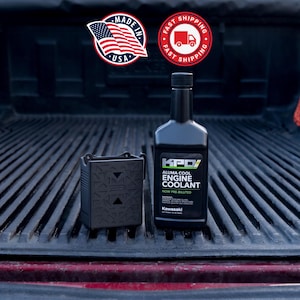 May include: A black plastic container with a geometric pattern and a black bottle of KPD Aluma Cool Engine Coolant by Kawasaki. The bottle label features white and green text, including the words Engine Coolant and Now Pre-Diluted.