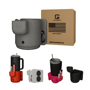May include: A gray insulated tumbler holder with a side compartment and carabiner clip. The product is displayed with a cardboard box featuring the American flag and the text "GOODBUY" and "MADE IN AMERICA". Additional color variations are shown.