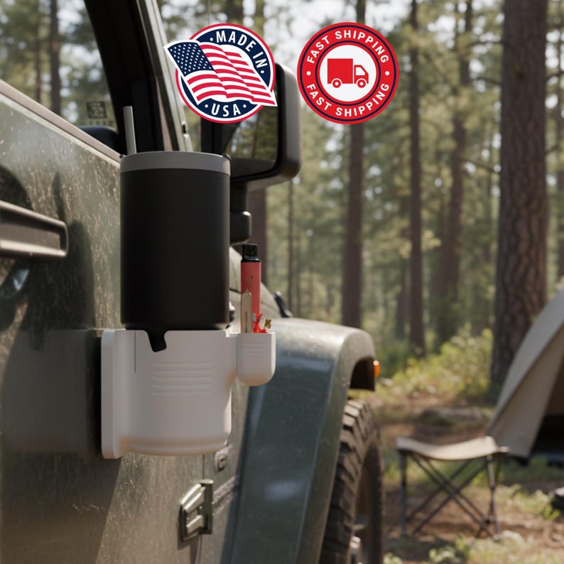May include: A black tumbler with a straw and a white accessory holder attached to a vehicle. The holder has a compartment for a pen and other small items. The image includes a "Made in USA" sticker and a "Fast Shipping" sticker.