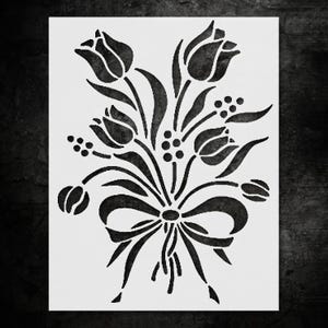 May include: A set of three ceramic mugs with a speckled, matte finish. The mugs are in shades of cream, light gray, and dark gray. Each mug has a simple, minimalist design, perfect for coffee or tea.