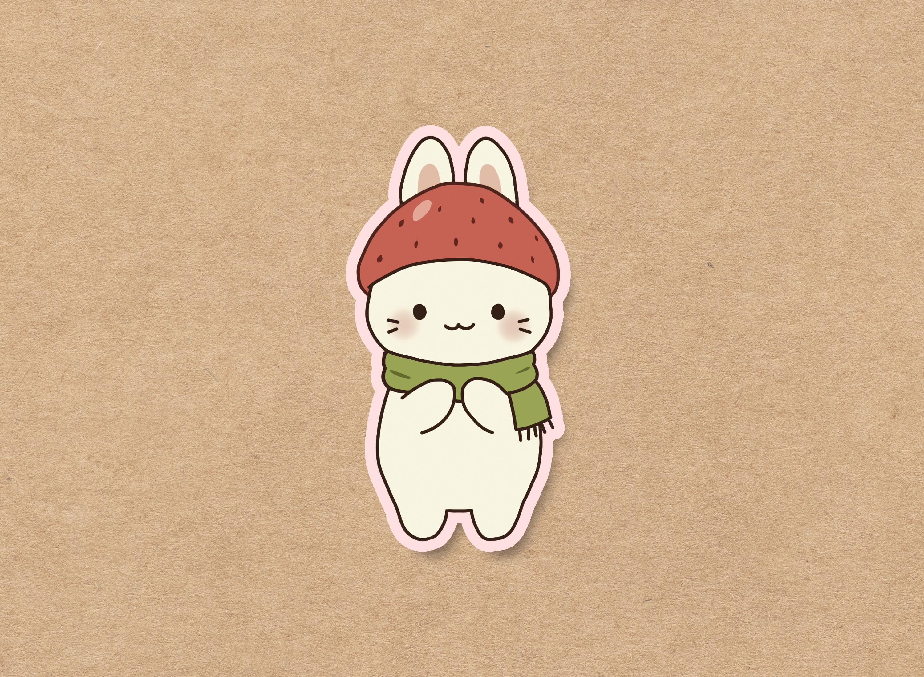 Strawberry bunny wearing a cozy green scarf, waterproof vinyl sticker