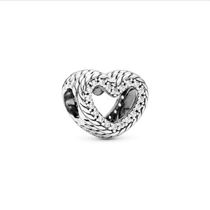 May include: A silver heart-shaped charm with a woven texture and a row of clear, sparkling stones around the inner heart. The charm is designed to be a pendant or bead for a bracelet or necklace.