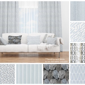 May include: A white sofa with gray patterned curtains and pillows. The sofa is in a room with a wooden floor. The image also shows a variety of fabric swatches with different patterns, including geometric, animal print, and floral.