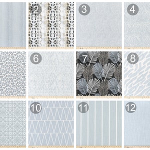 May include: Twelve different fabric swatches in various patterns and colors, including gray, white, and black. The swatches are numbered 1 through 12.
