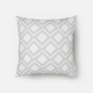 May include: A white cushion with a grey diamond pattern.