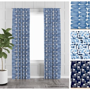 May include: Two blue and white patterned curtains hanging in a window. The curtains feature a repeating pattern of abstract shapes. The text "**Scroll to next photo to see full fabric selection" is at the bottom of the image.