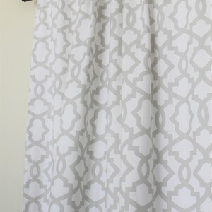 May include: White curtains with a grey geometric pattern.
