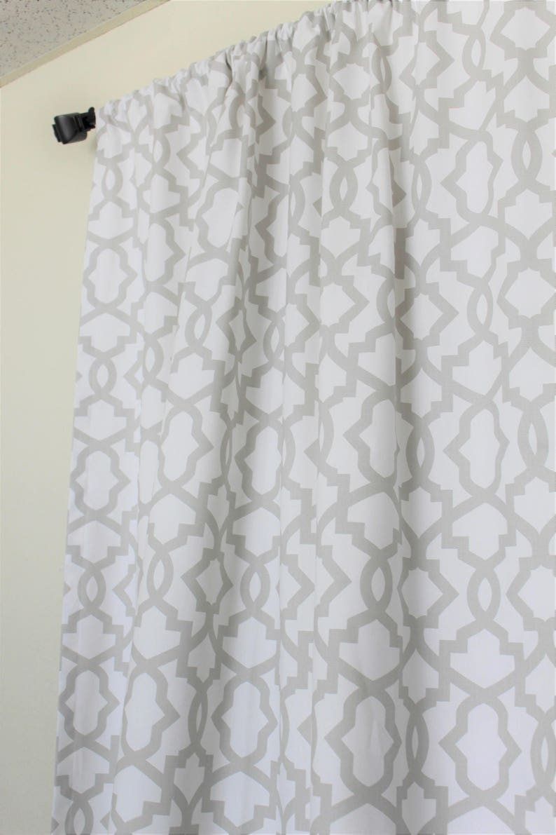 May include: White curtains with a grey geometric pattern.