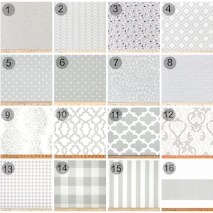 May include: A collection of 16 different grey and white fabric swatches with various patterns, including polka dots, hearts, stars, and geometric designs.