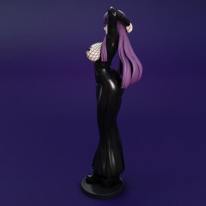 May include: A black figurine of a woman with long purple hair, wearing a black outfit with a fishnet top. The figure is standing on a black circular base against a dark purple background.