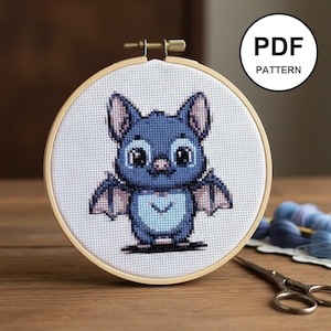 May include: A set of three ceramic mugs with a speckled, matte finish. Each mug features a different color: light blue, cream, and gray. The mugs have a simple, modern design and a comfortable handle.