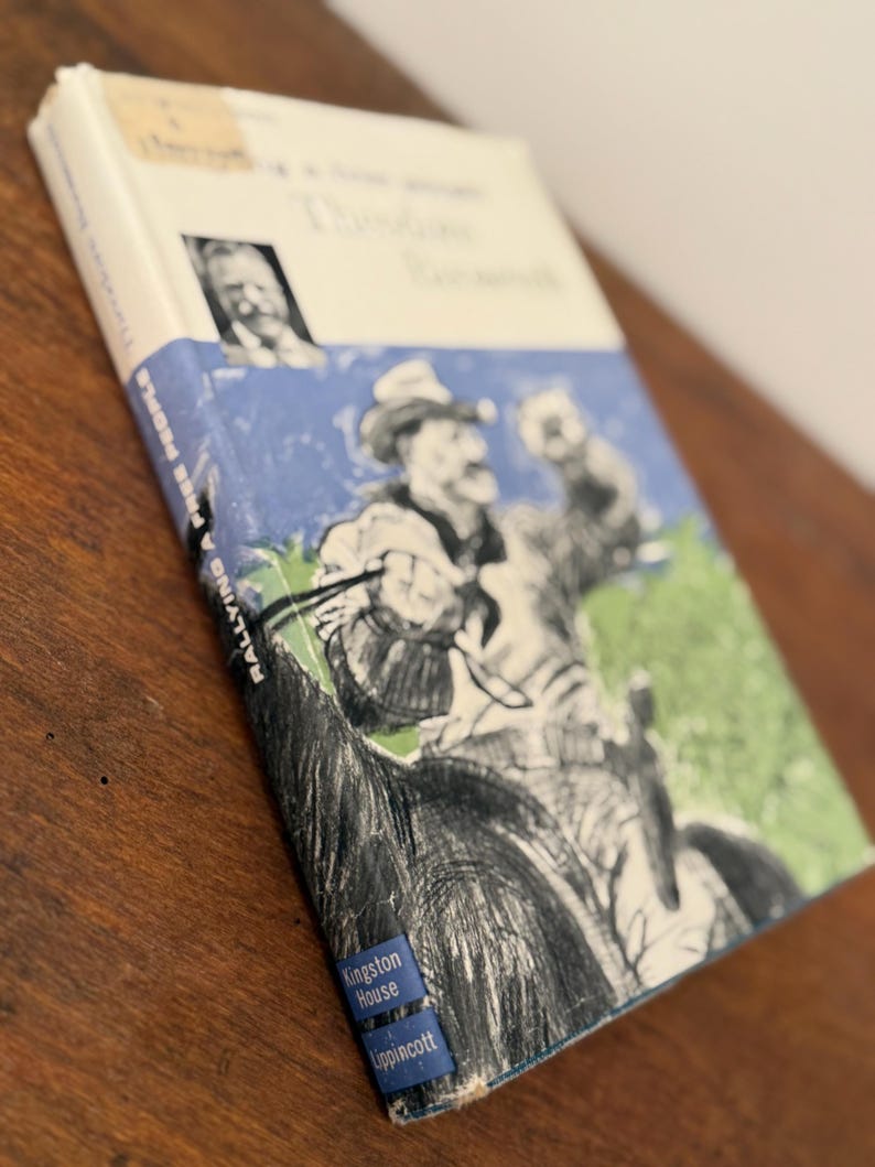 May include: A vintage book titled "Rallying to Free People" by Theodore Roosevelt. The cover features an illustration of a man on horseback, with blue and green accents. Published by Kingston House Lippincott.