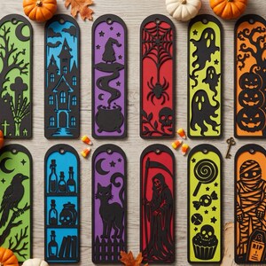 May include: A set of twelve rectangular bookmarks featuring black laser-cut Halloween designs layered over colorful backgrounds. Motifs include a haunted house, spider web, ghosts, pumpkins, a black cat, a grim reaper, and a mummy on a tombstone.