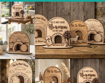 May include: Laser-cut wooden Easter decorations with arched designs. Each piece features the text "He Is Risen" and related phrases, along with images of a tomb, lamb, and cross. The decorations are made of light-colored wood.