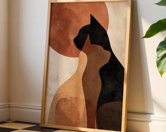 以下が含まれることがあります： 2匹の猫のシルエットをミニマルにデザインした、額装されたアートプリント。暖色系の色使いで、茶色と黒の色合いが使われています。背景はニュートラルで、自然な木製のフレームに入っています。
